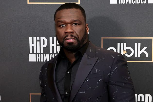 After allegedly striking the host of Power 106 with a microphone, 50 Cent was charged with battery.
